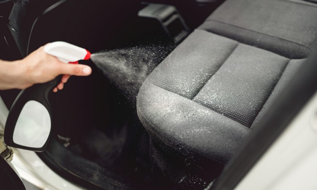 Professional cleaners wiping windows and Car wash